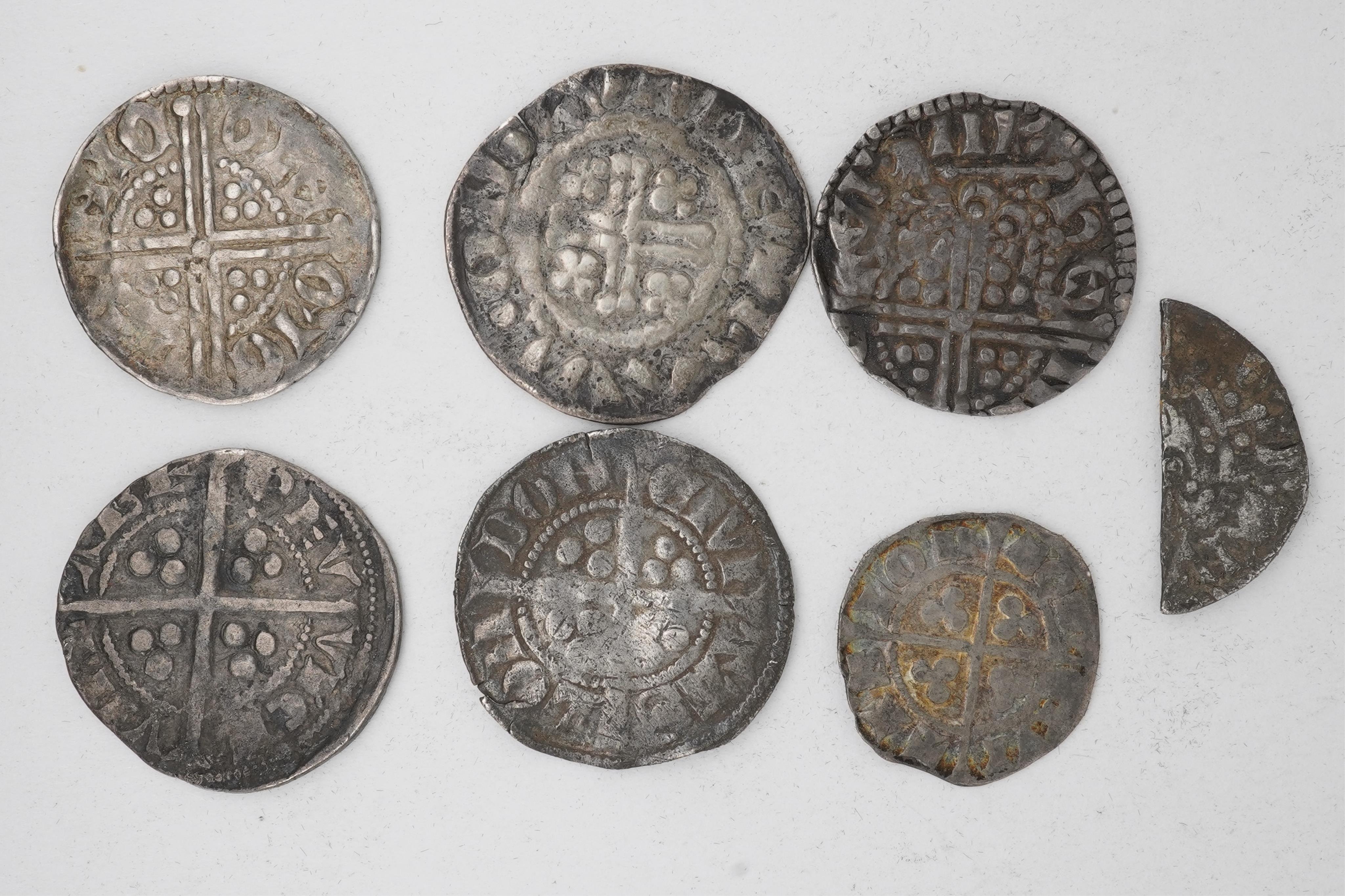 Seven British hammered silver coins, Plantagenet kings;, Henry III (1216-1272), long cross penny, a short cross penny, a double struck long cross penny, scarce, a cut halfpenny, Edward I (1272-1307), silver long cross pe